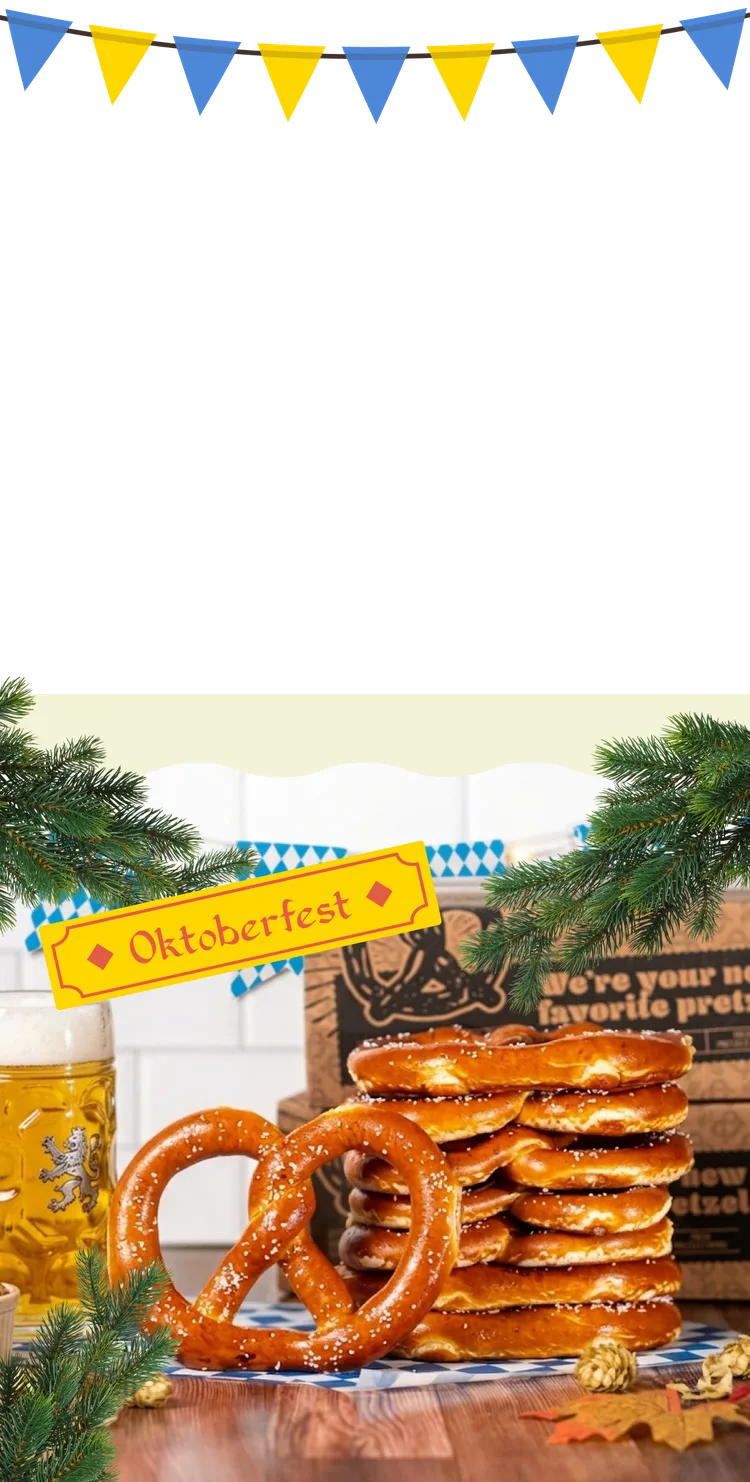 a stack of bavarian soft pretzels with a beer stein, oktoberfest bunting and pine sprigs