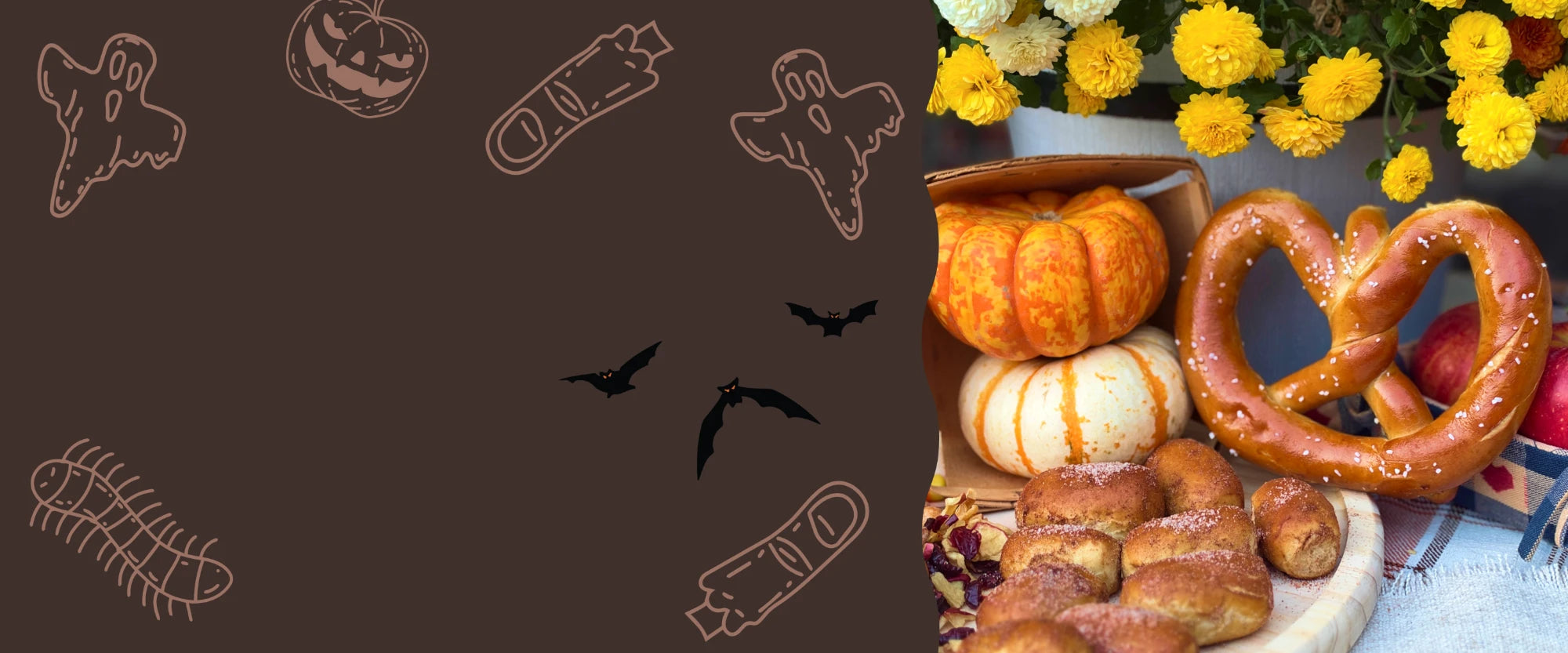 a stack of pumpkin-shaped soft pretzels on a candlelit fall table with pumpkins and lanterns